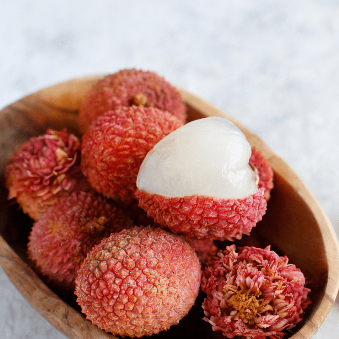 Bowl of lychee fruit with peony florals