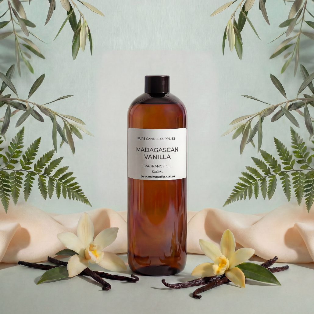 Bottle of Madagascan Vanilla fragrance oil with vanilla flowers and leaves on a light background