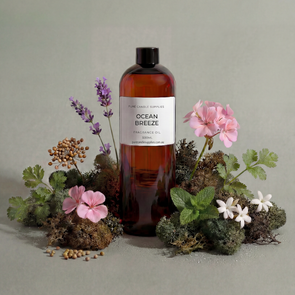 Bottle of 'Ocean Breeze' product surrounded by flowers and plants on a neutral background