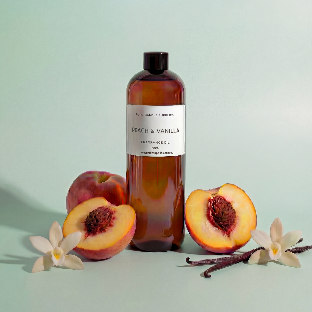 Bottle of peach and vanilla fragrance oil with peaches and vanilla beans on a light green background