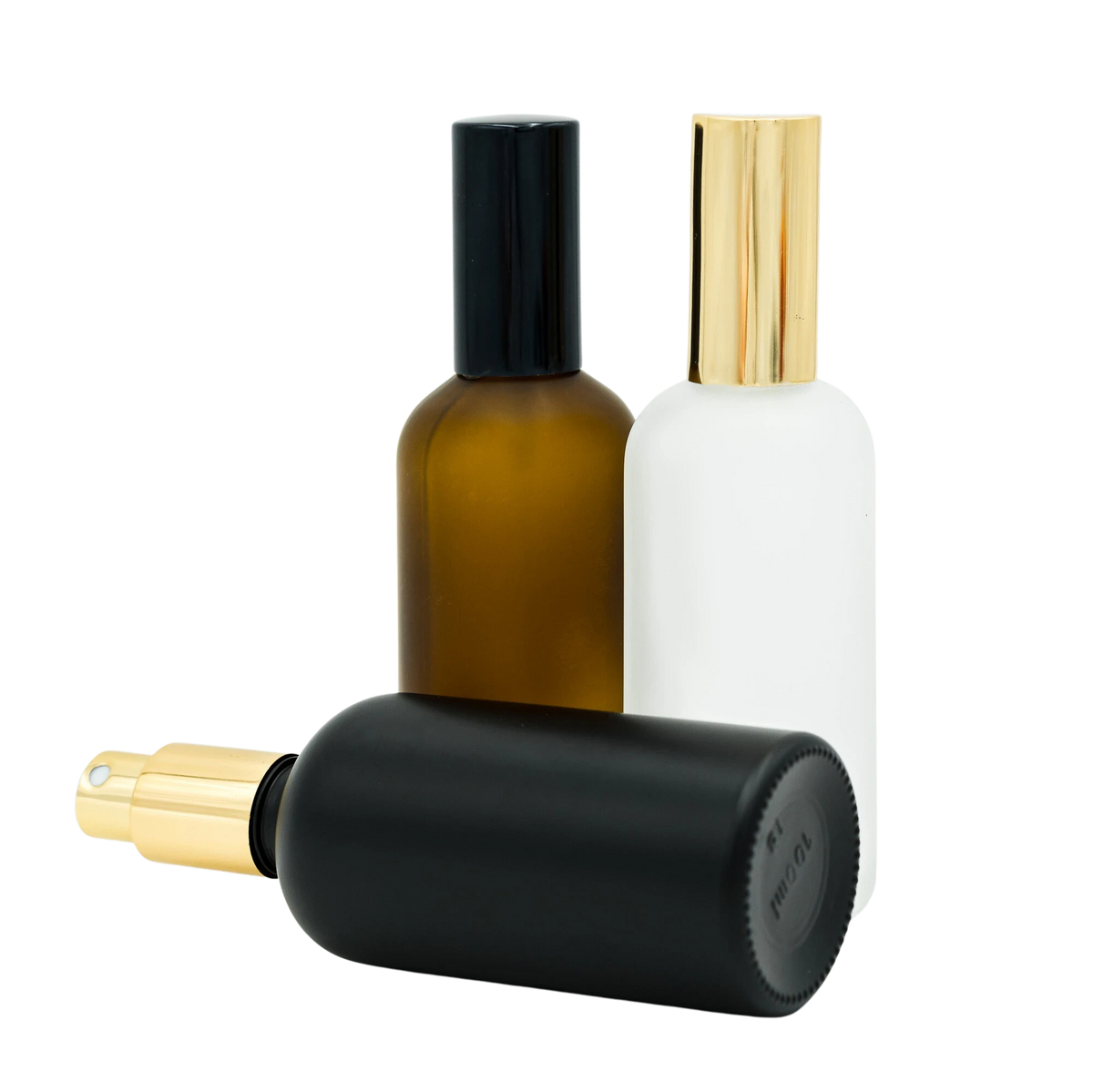 Pure Candle Supplies Melbourne 100ml room spray bottles in matte black, amber, and white glass with gold spray caps.