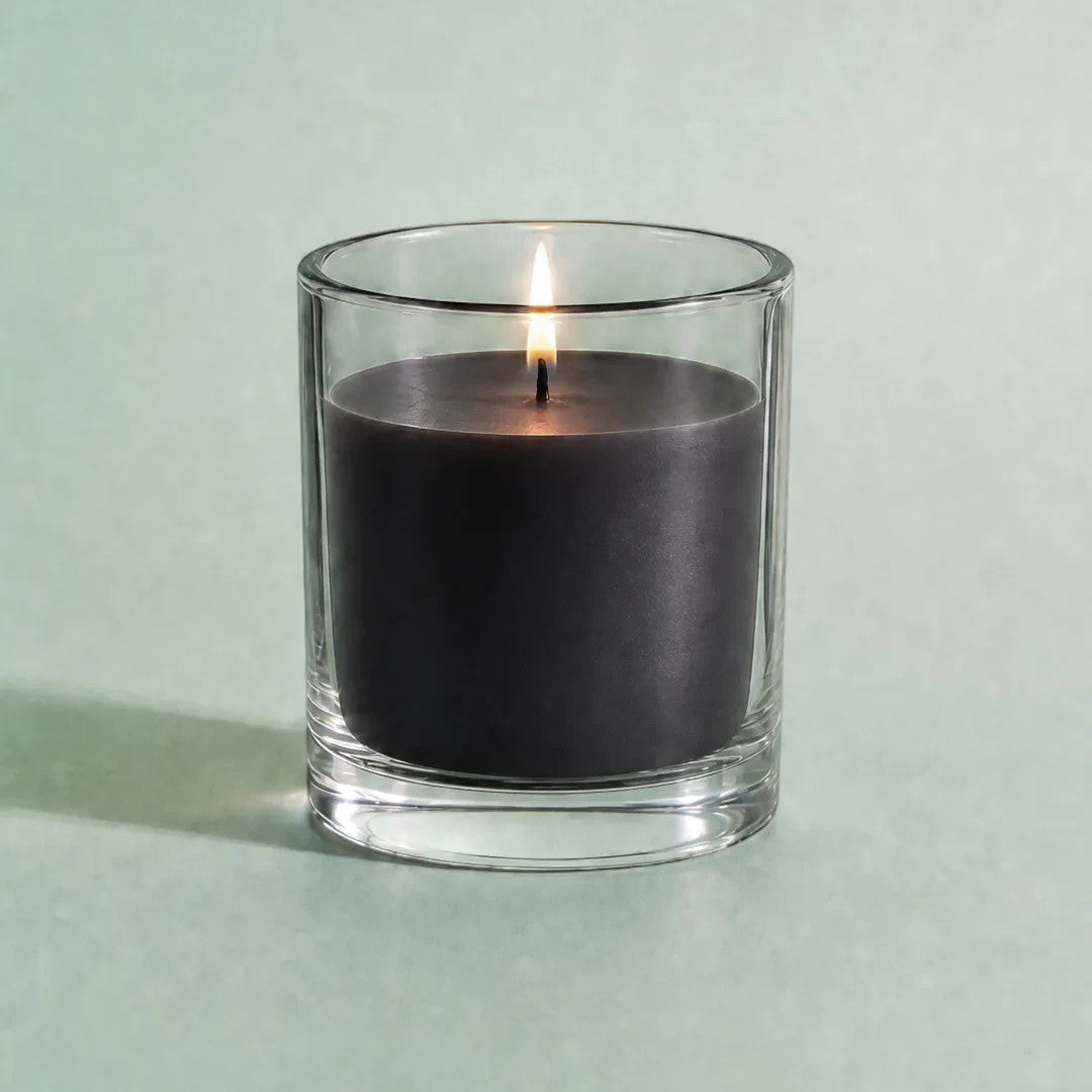 Pure Candle Supplies Melbourne black candle dye chip result in a clear glass container with a lit wick