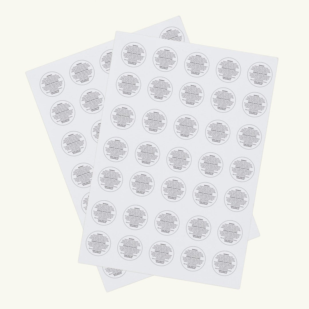 Pure Candle Supplies Melbourne A4 sheet of 35 circular candle safety warning labels with black text on white paper.