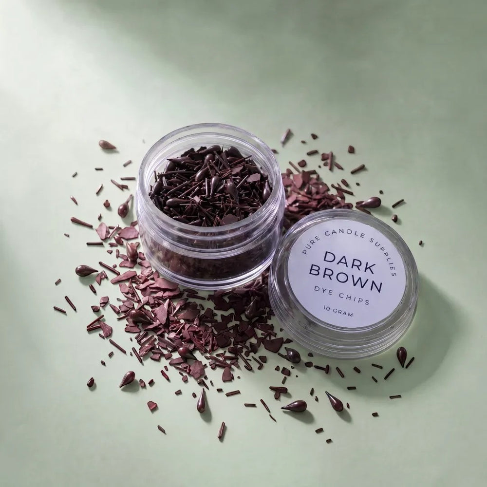Pure Candle Supplies Melbourne dark brown candle dye chips in a small clear jar on a light green background.