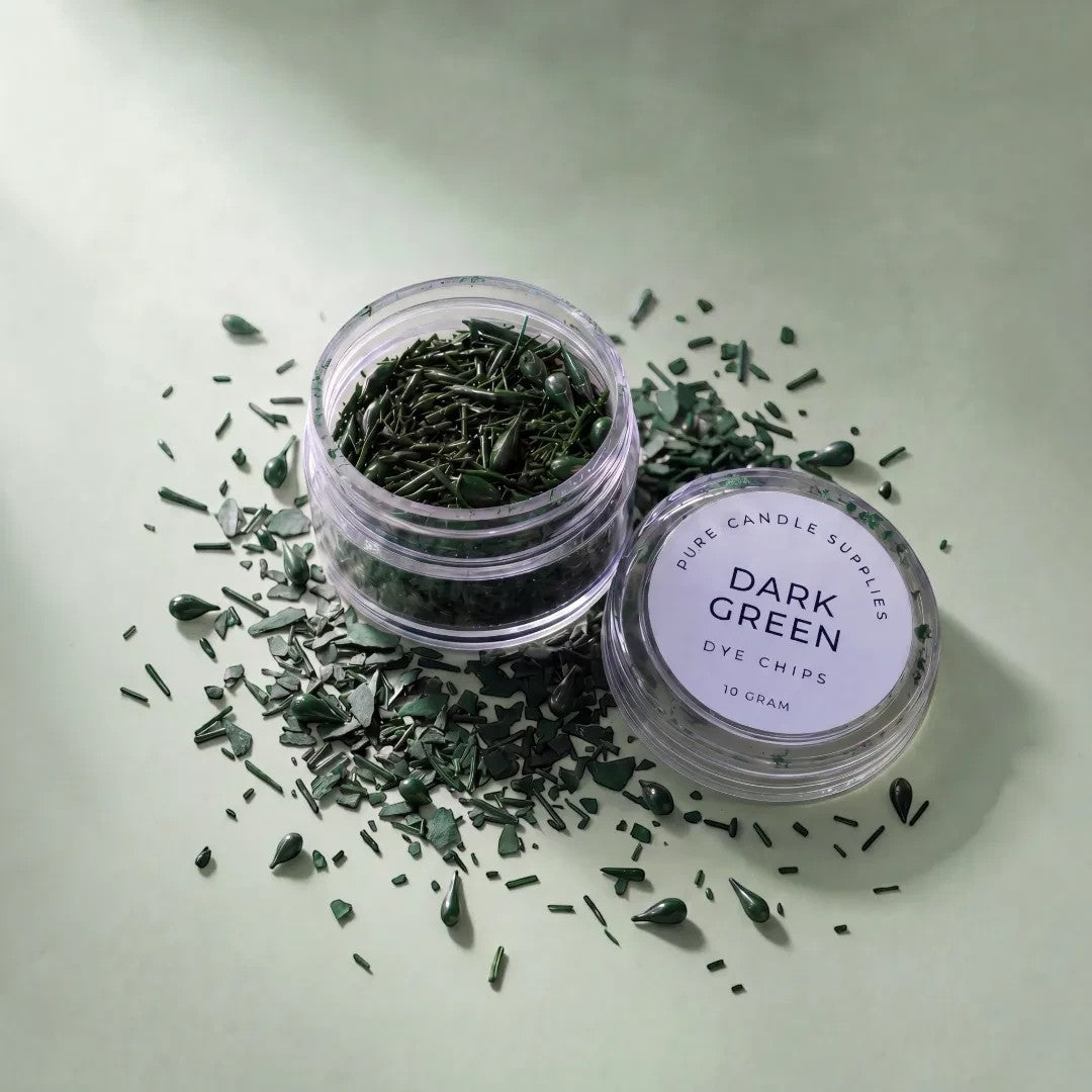 Pure Candle Supplies Melbourne dark green candle dye chips in a small clear jar on a light green surface