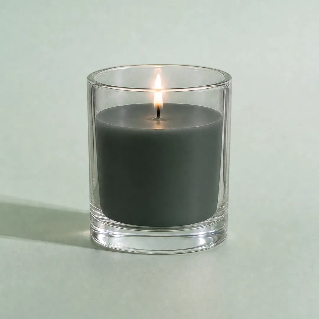 Pure Candle Supplies Melbourne forest green candle dye chip result in a clear glass container with a lit wick