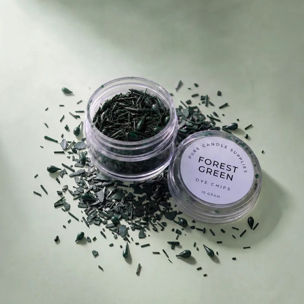 Pure Candle Supplies Melbourne forest green candle dye chips in a small clear jar on a light green background.