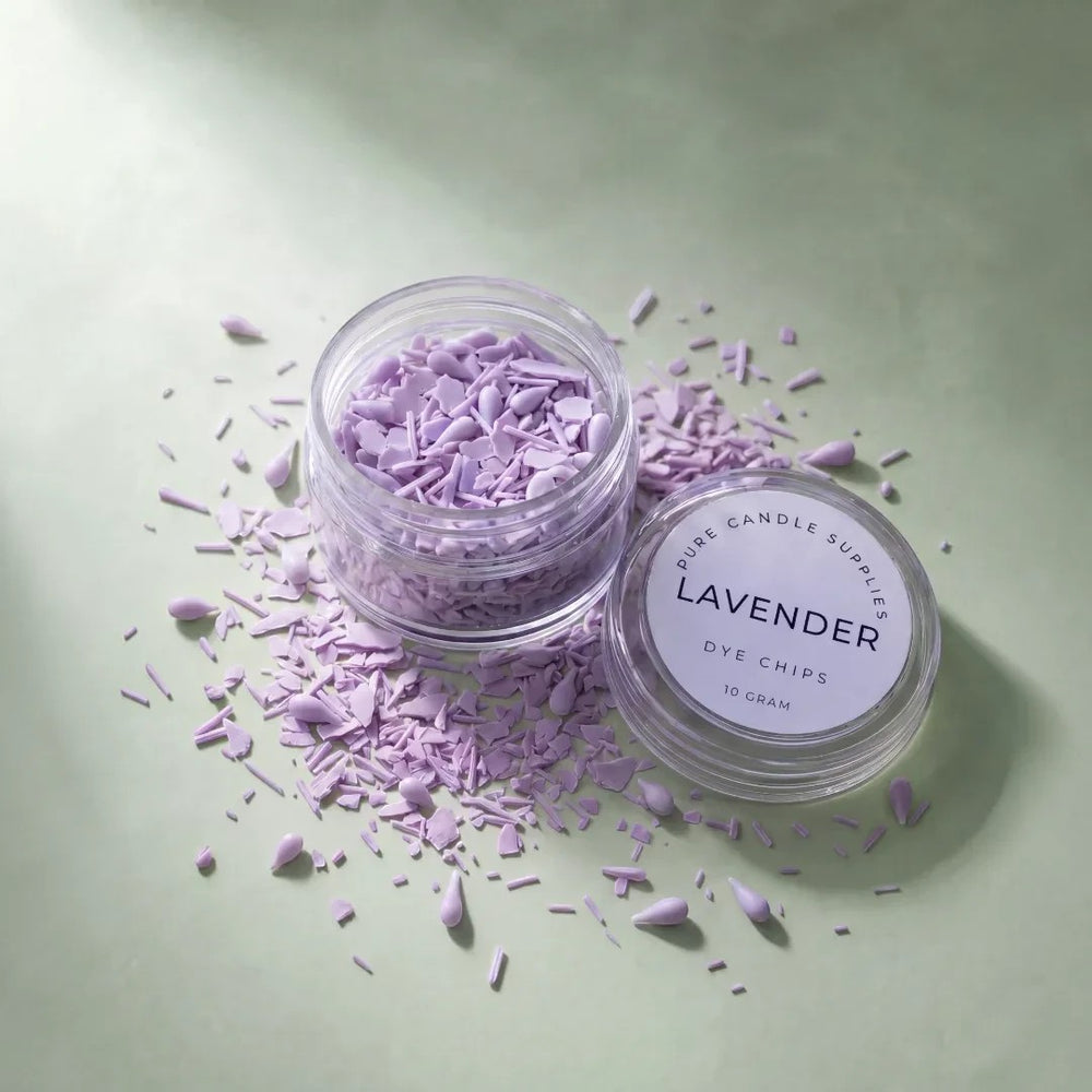 Pure Candle Supplies Melbourne lavender dye chips for candle making in a small clear jar on a soft green background.
