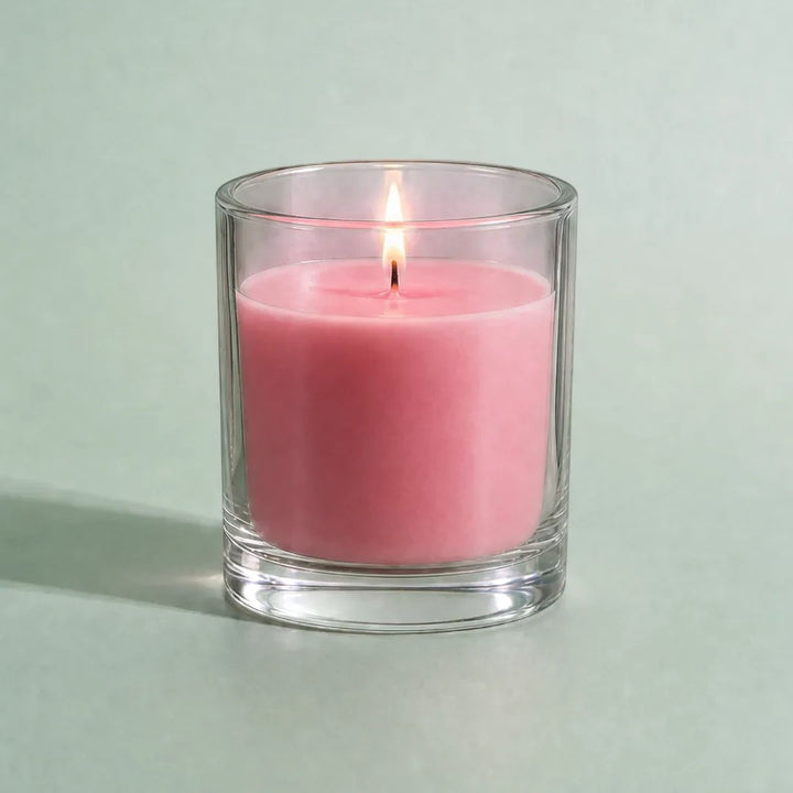 Pure Candle Supplies Melbourne light rose candle dye chip result in a glass container with a lit wick