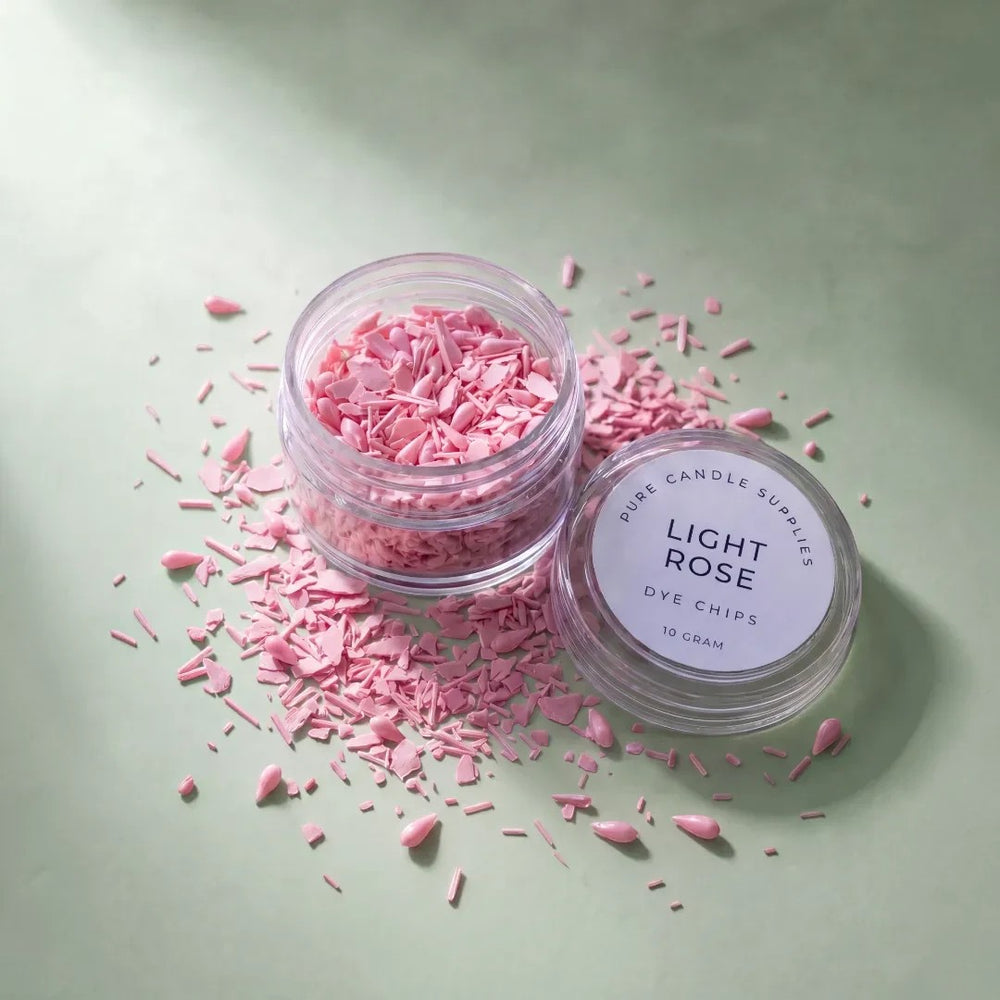 Pure Candle Supplies Melbourne light rose candle dye chips in a small clear jar on a soft green background.