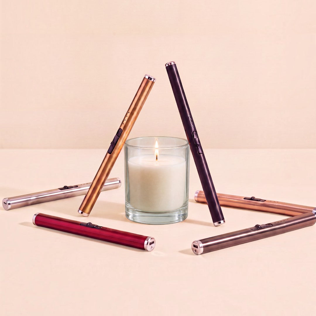 Pure Candle Supplies Melbourne Luxe USB plasma arc lighters in various metallic colours surrounding a lit candle.