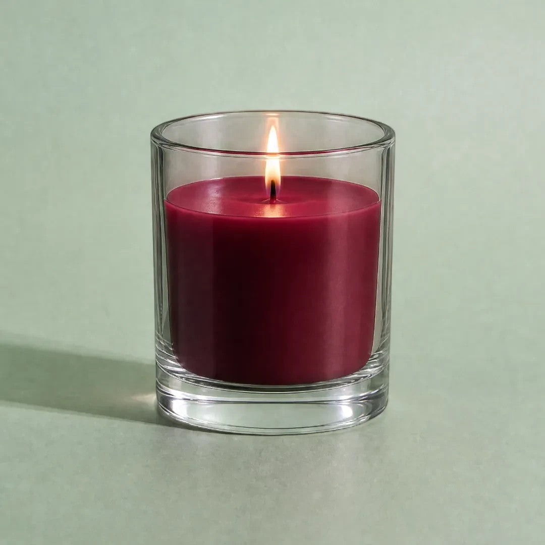 Pure Candle Supplies Melbourne mulled wine dye chip candle in a clear glass container with a lit wick