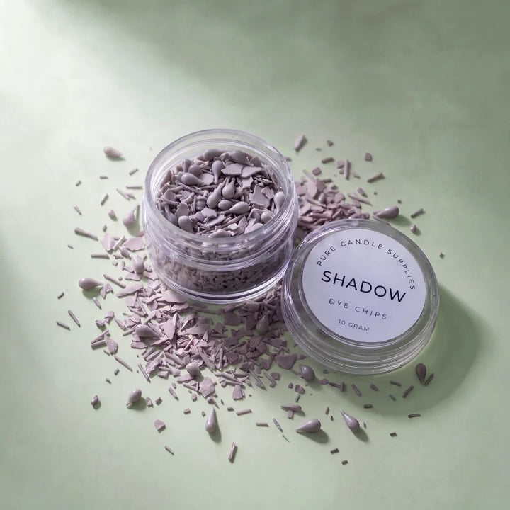 Pure Candle Supplies Melbourne Shadow grey candle dye chips in a small clear jar on a light green background.