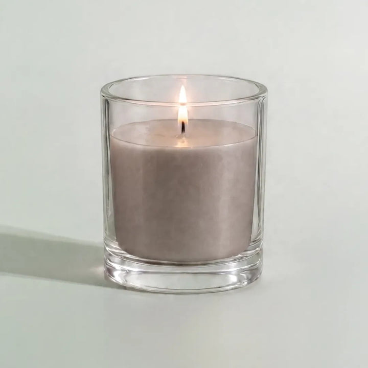 Pure Candle Supplies Melbourne silver dyed candle in a clear glass container with a lit wick