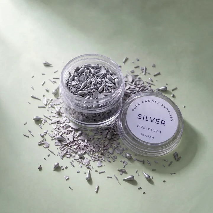 Pure Candle Supplies Melbourne silver candle dye chips in a clear jar on a soft green background
