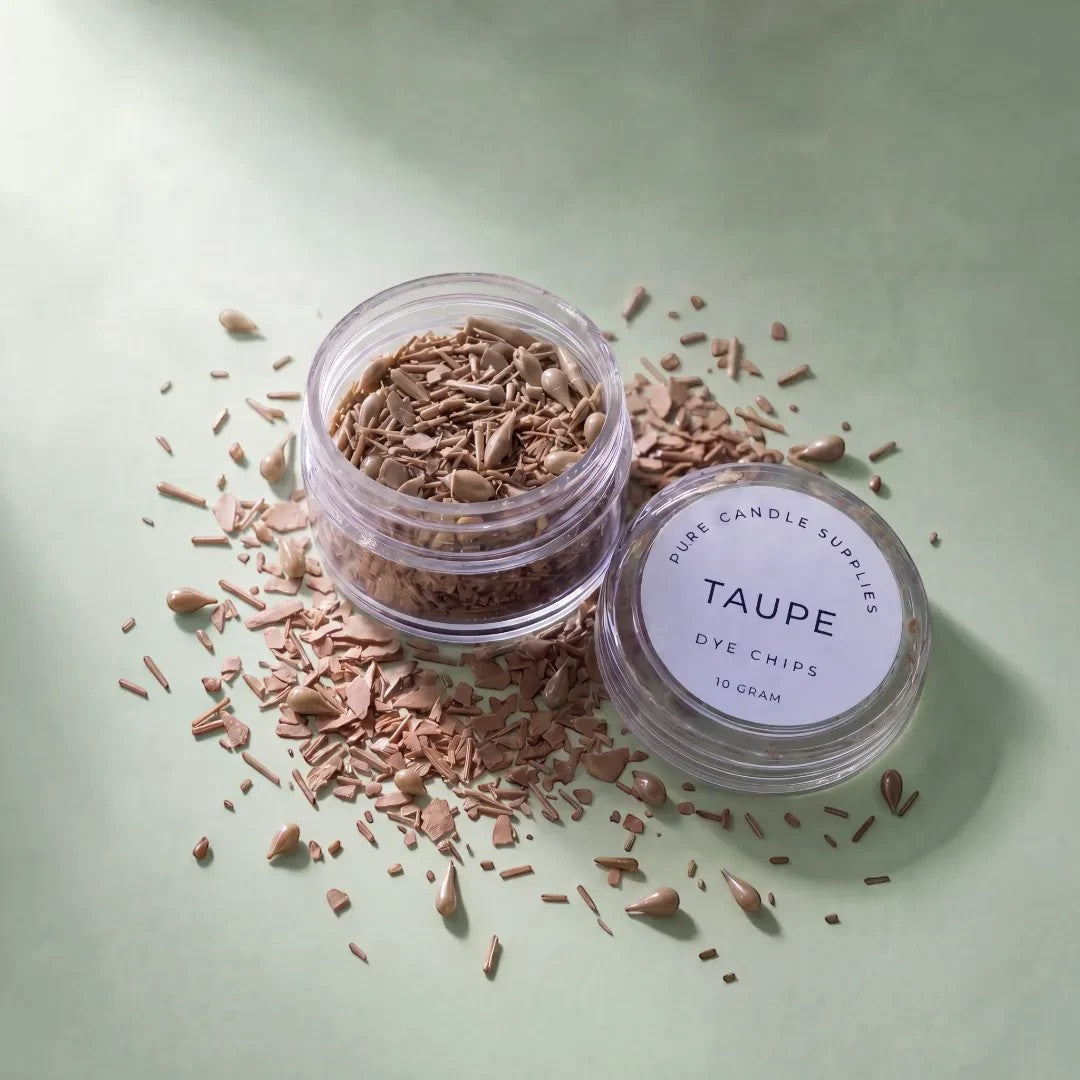 Pure Candle Supplies Melbourne taupe candle dye chips in a small clear jar on a soft green background