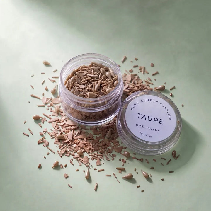 Pure Candle Supplies Melbourne taupe candle dye chips in a small clear jar on a soft green background
