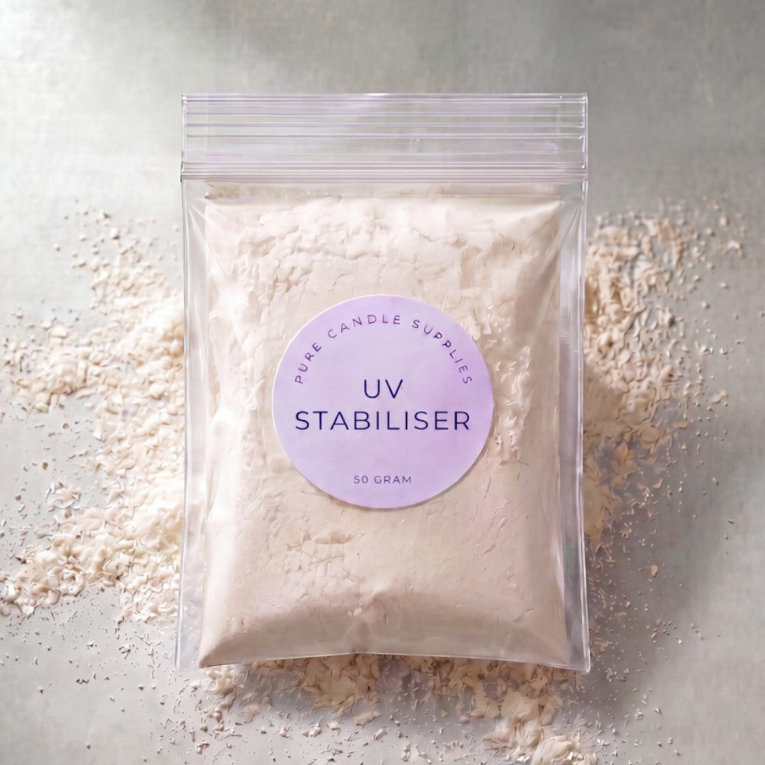 Pure Candle Supplies Melbourne UV Stabiliser powder in a clear plastic bag with a round label on a textured surface