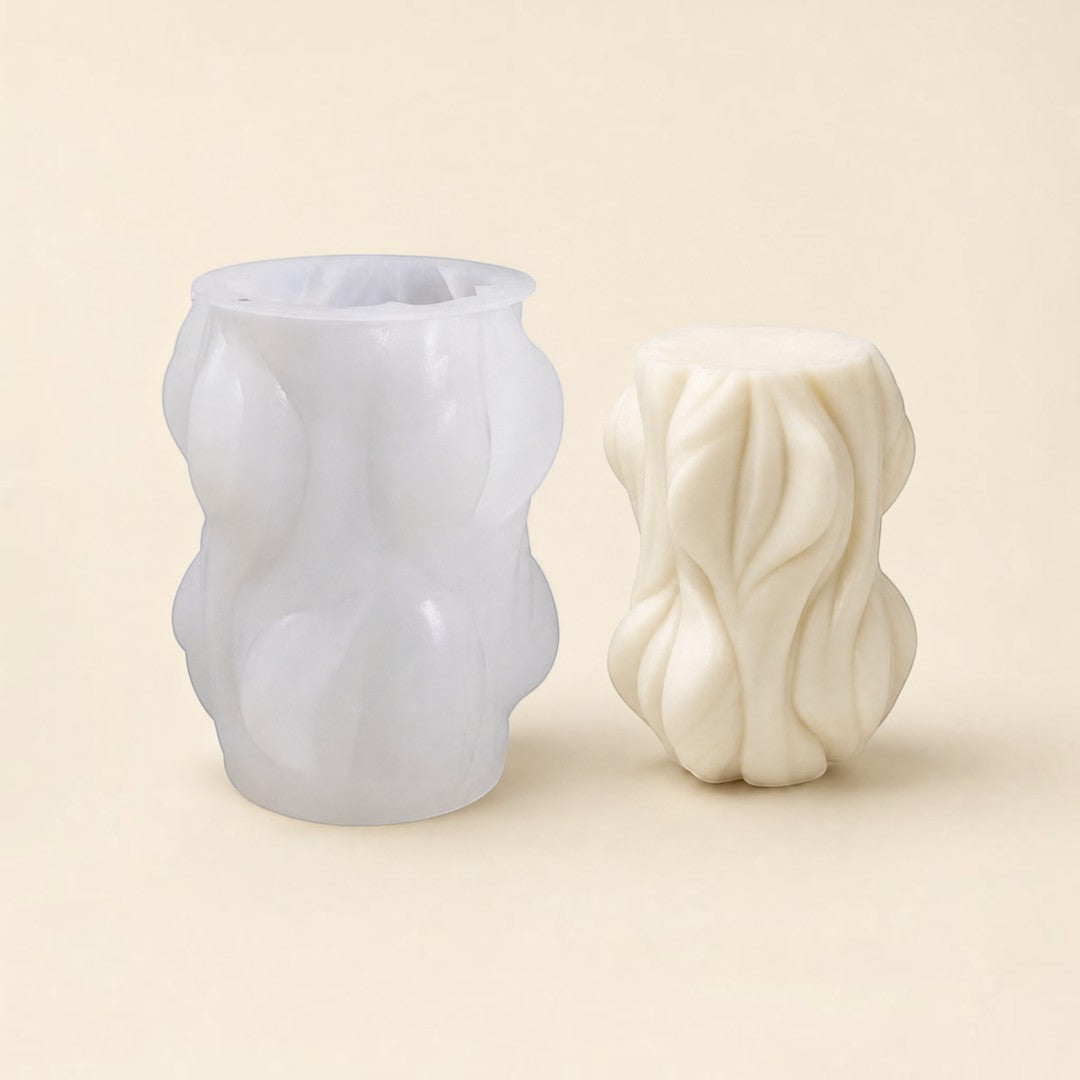 Pure Candle Supplies Melbourne woodland silicone candle mould next to a finished textured white wax candle