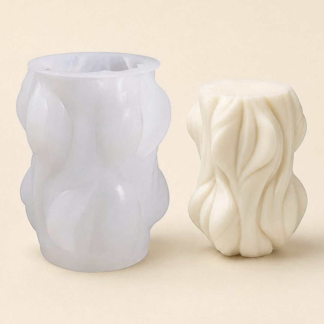Pure Candle Supplies Melbourne woodland silicone candle mould next to a finished textured cream candle