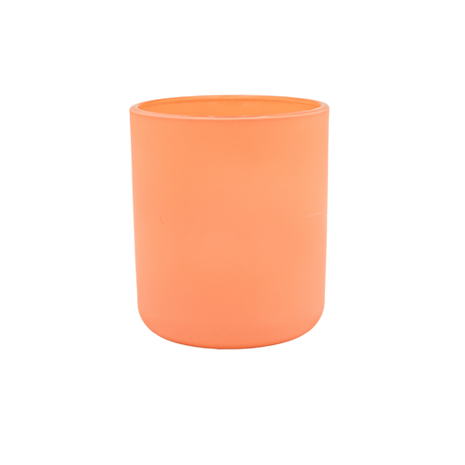 peach coloured round candle jar with curved base