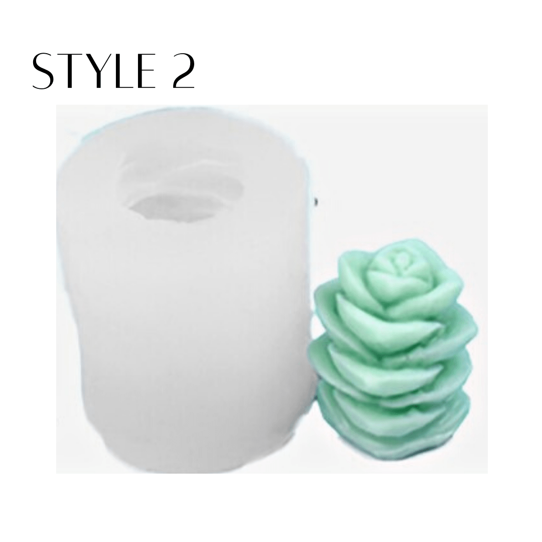 succulent shaped candle in green wax next to silicone mould on white background