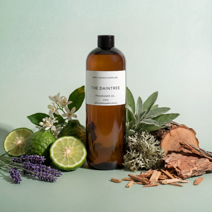 Bottle of 'The Daintree' fragrance oil with natural elements on a light green background