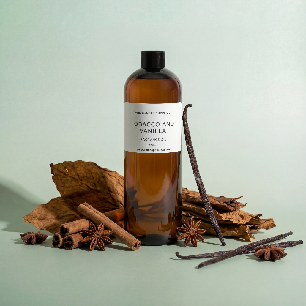 Bottle of Tobacco and Vanilla fragrance oil with vanilla beans and cinnamon sticks on a light green background