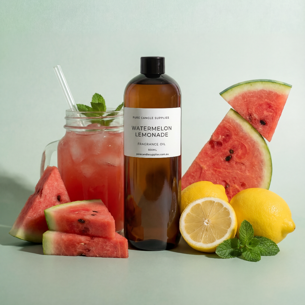 Bottle of watermelon lemonade with a glass of lemonade, watermelon slices, and lemons on a light background