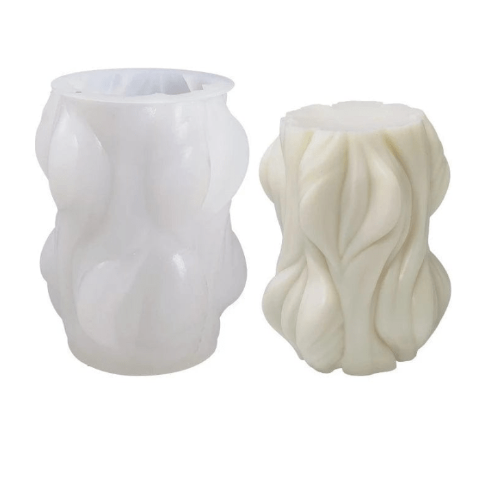 woodland shaped candle next to silicone mould against white background